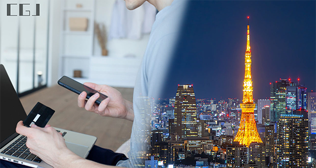 クレジットカード情報を入力する男性と夜の東京タワー